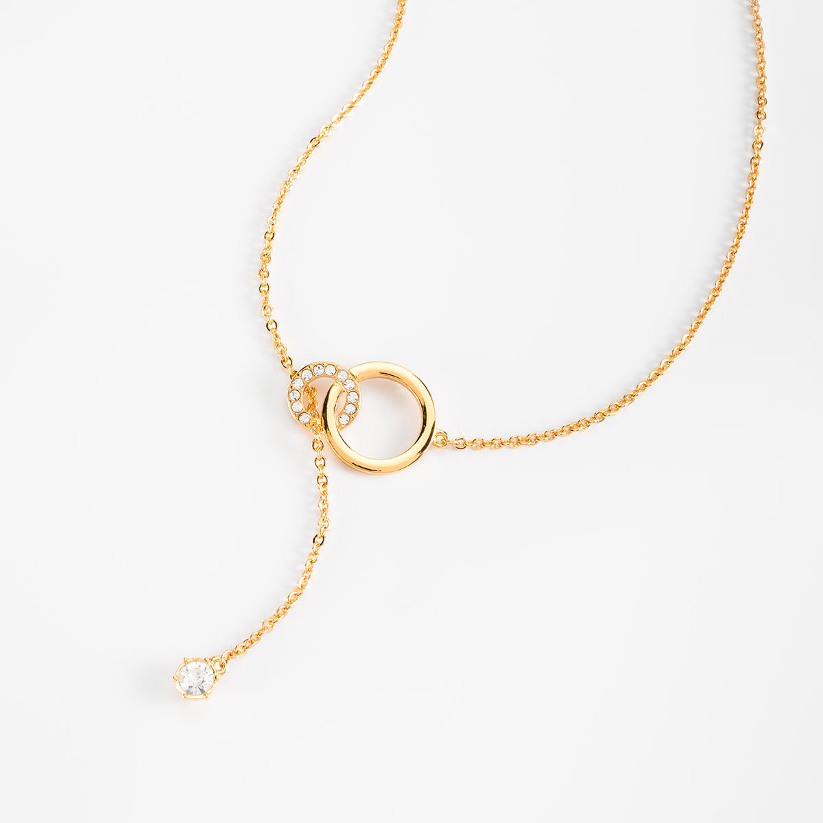 Collar en baño de oro con círculos y piedra en tono cristal