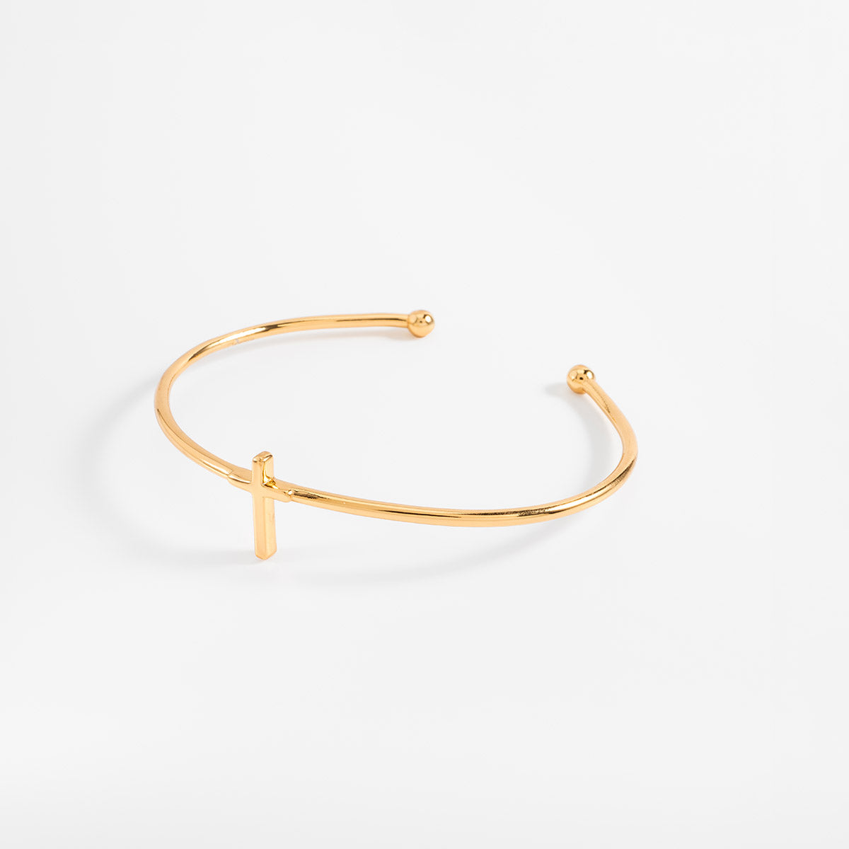 Pulsera en baño de oro diseño cruz minimalista abierta