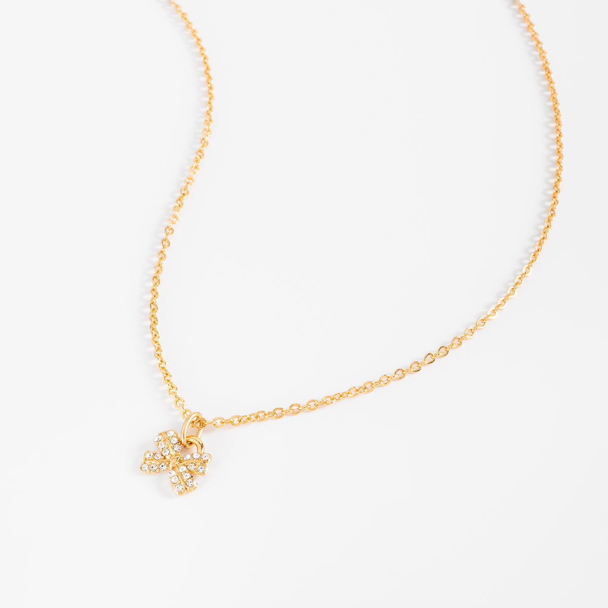 Collar en baño de oro dije moño piedras toque brillante