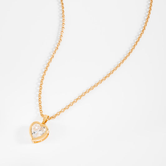 Collar en baño de oro dije corazón piedra en tono cristal